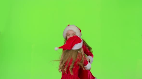 Children in Red New Year Costumes Are Dancing. Green Screen. Slow Motion alt