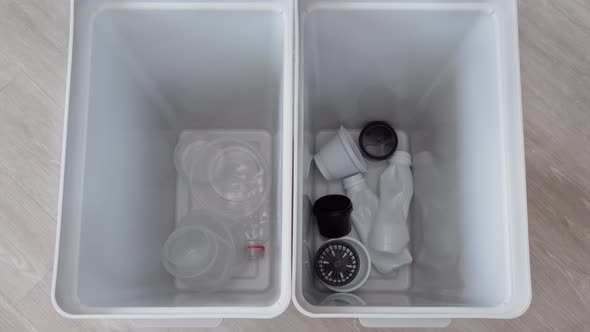 Stop Motion Animation Sorting of Garbage in Two Recycling Bins  Top View