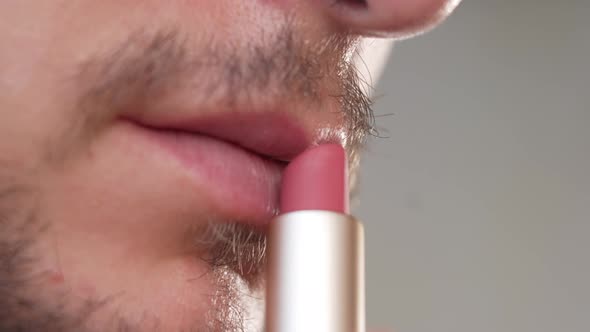 Man with a Beard Trying to Use Lipstick for the First Time in His Life