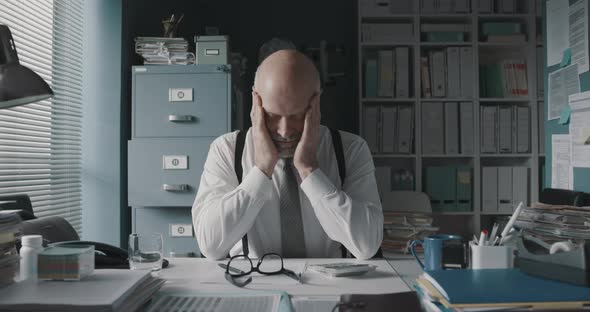 Exhausted businessman working in the office