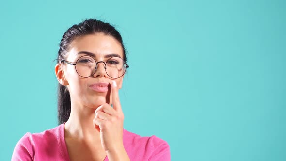 Happy Pleasant Girl Wearing Round Glasses and Warm Sweater alt
