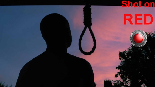 Man Trying To Commit Suicide By Hanging Himself On A Hangman Rope alt