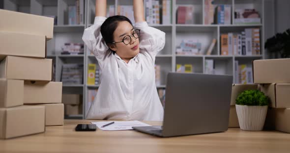 Woman stretching while working alt
