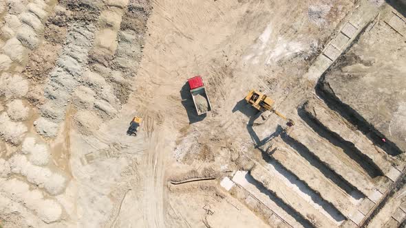 Bulldozer Works on Construction Site with Sand Aerial or Top View alt