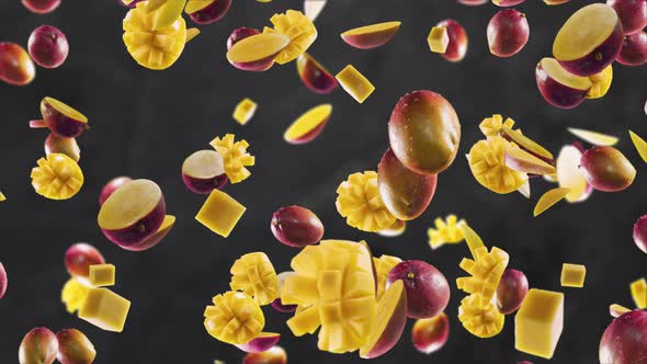 Mango with Slices Falling on Dark Kitchen Background alt
