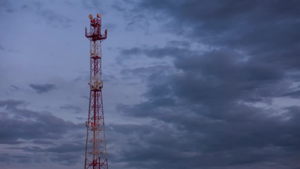 Cell Phone Tower Against Evening Sky with Clouds, Qualitative Time Lapse.