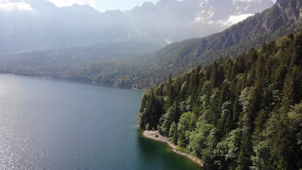 beautiful drone video of an lake and mountains, eibsee in bavaria alt
