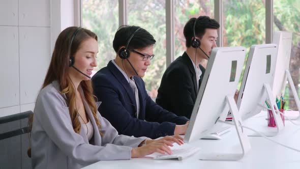 Business People Wearing Headset Working in Office alt