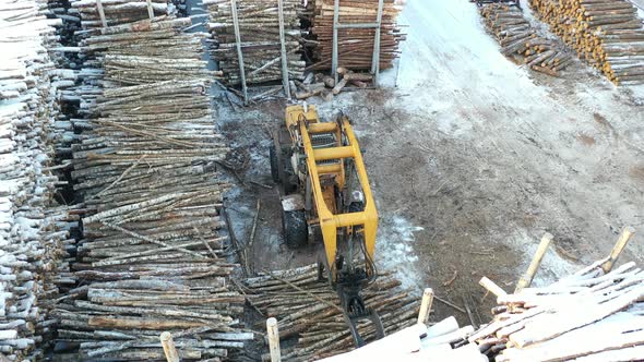 loader overloads a pile of logs, woodworking industry