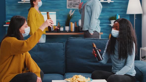 Multiracial Friends with Masks Enjoying a Beer alt