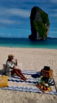 Koh Poda Krabi Thailand Asian Woman and European Men Having a Picnic on the Tropical Beach of Koh alt