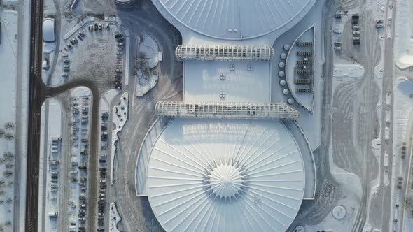 Top view in winter of a modern sports complex with parking in Minsk. Belarus alt