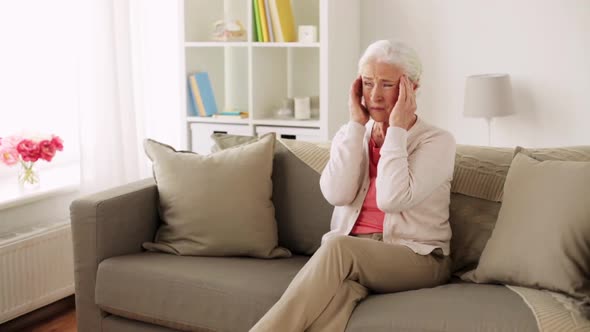 Senior Woman Suffering From Headache alt