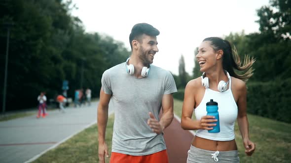 Beautiful Couple Jogging and Fitness Training Outdoor