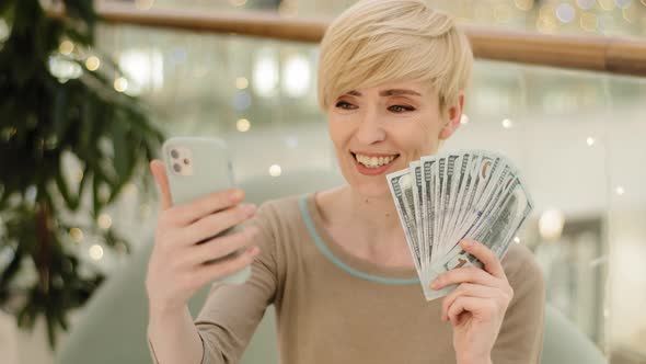 Wealthy Successful Mature Middle Aged Woman Holding Money Dollars Bills Recording Video Call Online alt