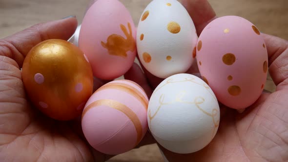 Lots of Multicolored Easter Eggs in Hands