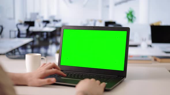 Man Using Green Screen Laptop