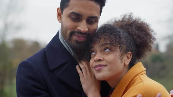 Portrait Of Loving Couple On Outdoor Walk Through Autumn Countryside Together