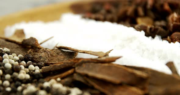 Various spices in plate 4k alt