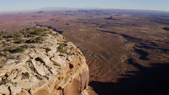 Aerial shot of the cliffs along the edge of Cedar Mesa in Southern Utah alt