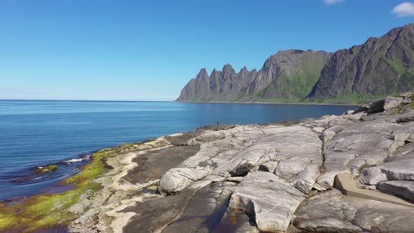 Popular travel destination and Rock Davil’s Jaw in the sunny summer day, Norway,island Senja