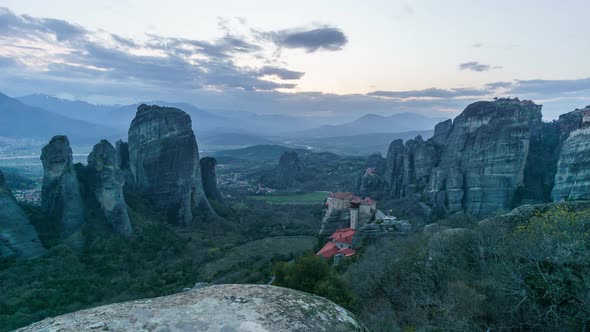 Time lapse of sunset to night transition with partly cloudy sky of the famous Eastern Orthodox monas alt