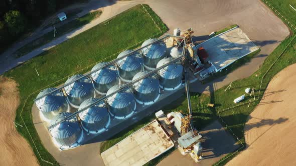 Aerial Elevated Top View Modern Granary Graindrying Complex Commercial Grain Or Seed Silos In Sunny alt
