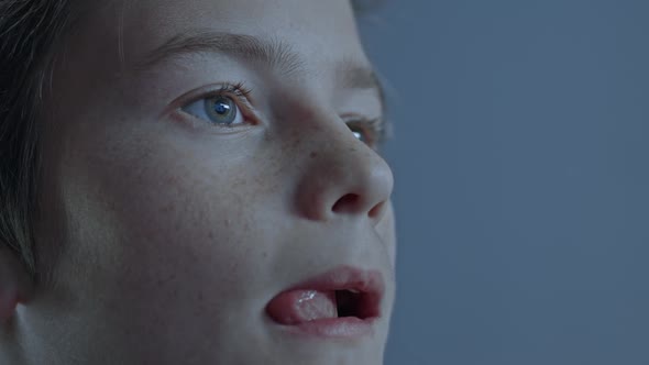 Closeup View Of Excited Young Gamer Playing and Winning in Online Video Game on His Personal alt