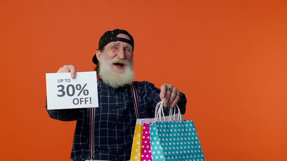 Elderly Bearded Man Showing Shopping Bags and Up To 30 Percent Off Inscriptions Text Black Friday alt