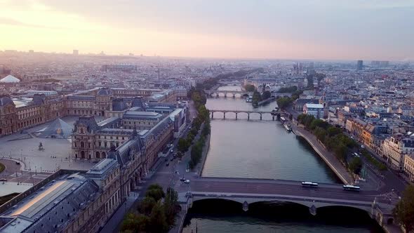 Morning panning footage of Paris from drone. Large complex of Louvre museum with Place du Carrousel alt