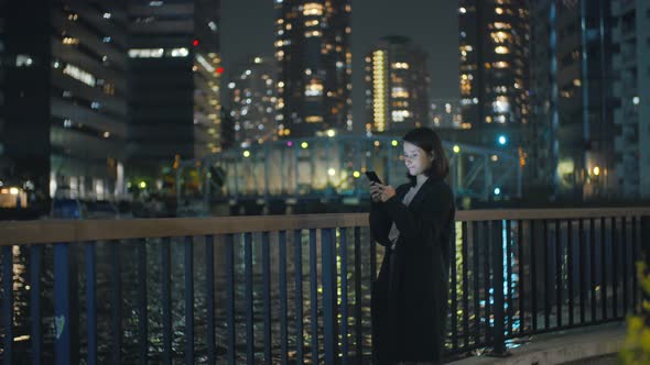 Girl With Smartphone At Night 