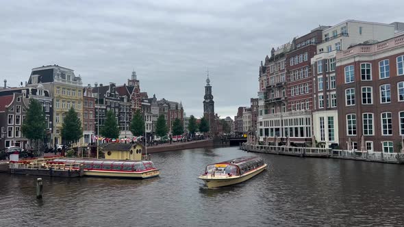 Cruise Boat On The Background Of The City Of Amsterdam