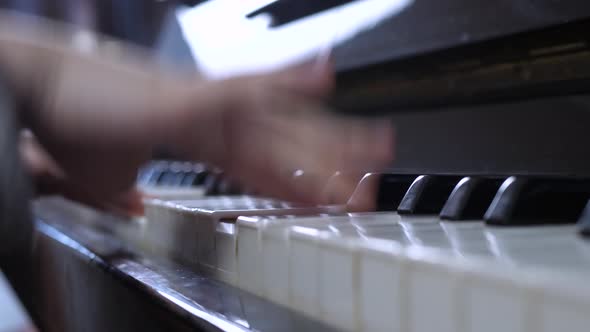 Little Kid's Hand Playing Piano