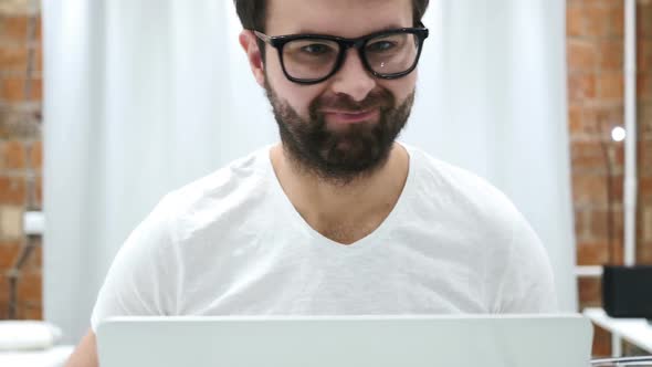 Shaking Head to No Young Beard Man Working on Laptop at Home, Stock Footage