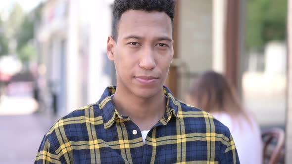 Funny Young African Man Searching with Handmade Binoculars alt