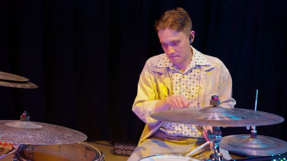 Jazz Drummer Begins to Rhythmically Play Drums