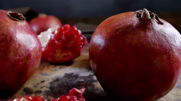 Whole Pomegranate Fruit Rotating on a Table