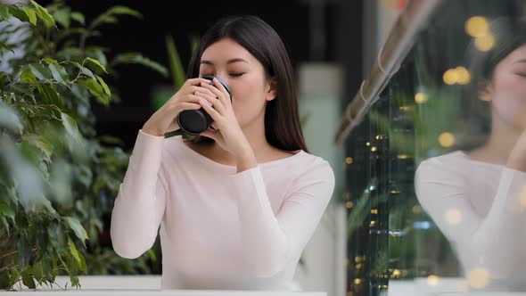 Asian Girl Woman Smiling Enjoying Drinking Fragrant Delicious Coffee Hot Tea Morning Cappuccino in alt