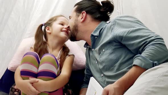 Little Girl and Her Father Reading a Book Together alt