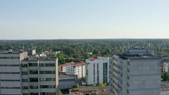 Reverse fly through aerial view of two large towers in a Finnish city near Helsinki. alt