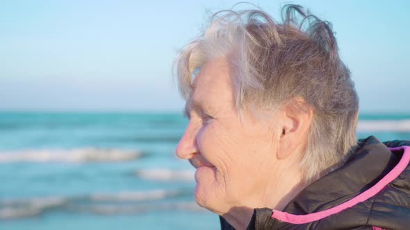 Senior Woman Smiles Enjoying Azure Sea View at Chioggia alt
