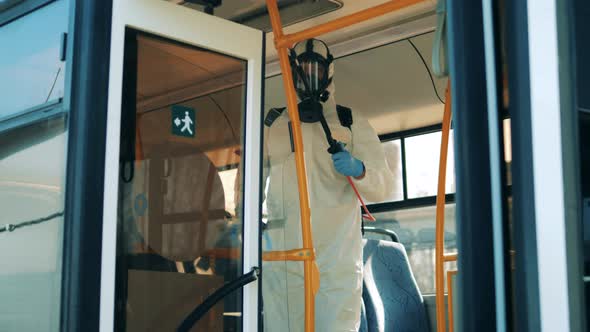 Bus Entrance Is Getting Sanitized By a Disinfector alt