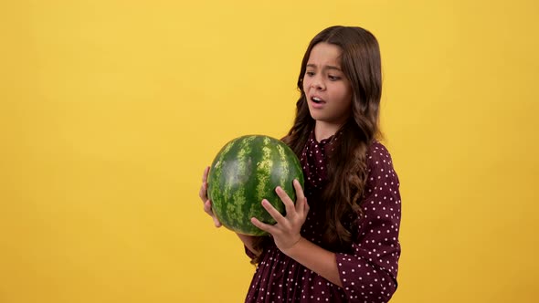 Amazed Girl Hold Heavy Water Melon Checking the Quality and Approve with Thumb Up Gesture Fruit