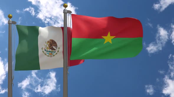 Mexico Flag Vs Burkina Faso Flag On Flagpole alt