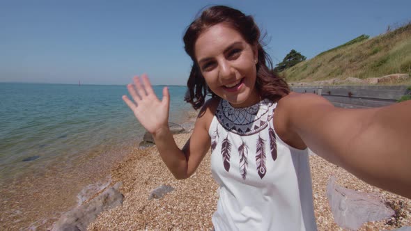 POV Shot of Young Woman Video Challing A Friend At The Beach In Slowmotion alt