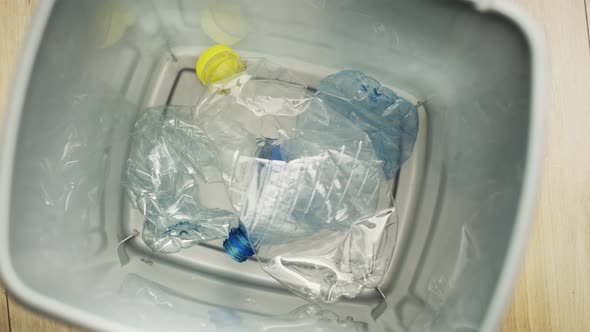 Static video of throwing plastic bottles. Shot with RED helium camera in 8K. alt