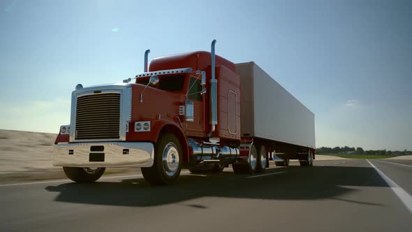 Huge semi-trailer cargo truck riding on the highway. Front view animation. HD alt