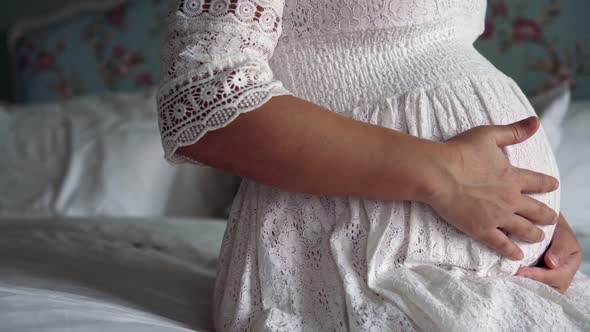 Happy Pregnant Woman and Expecting Baby at Home alt