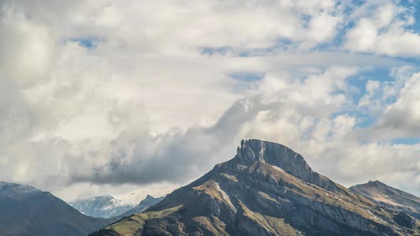 Mountains with clouds and a lake alt