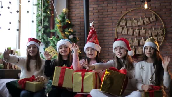 Happy children open New Year gifts for New Year alt